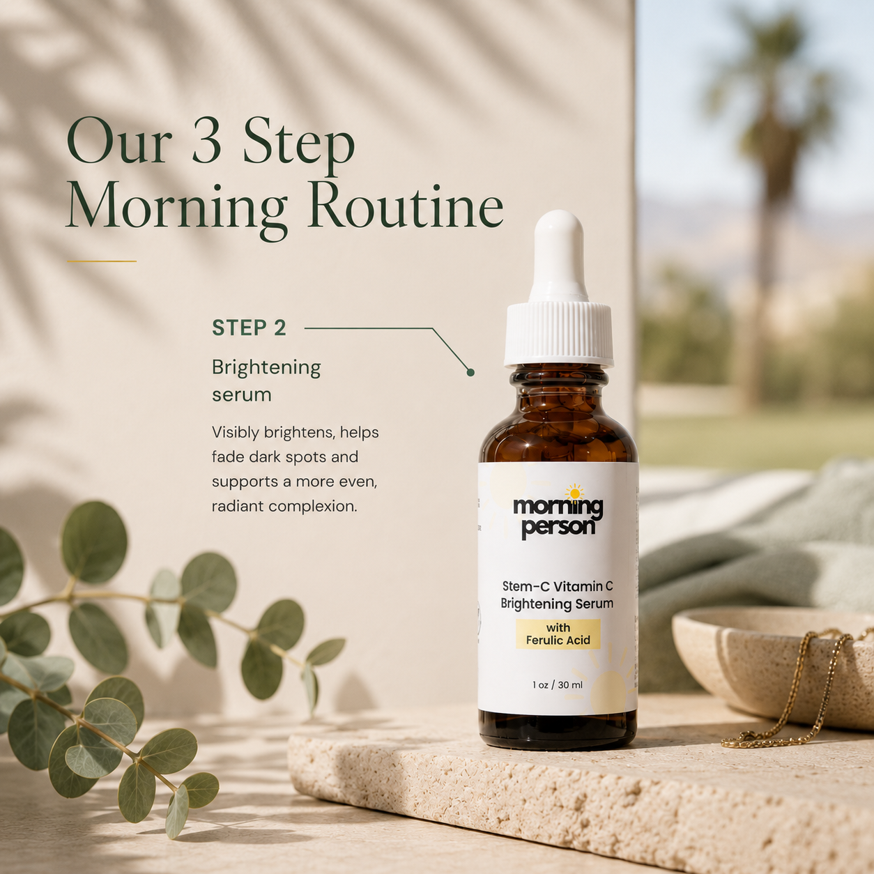 An amber glass dropper bottle labeled morning person Brightening Serum with Ferulate Acid, placed on a stone surface in a softly styled bathroom setting with eucalyptus leaves and a towel in the background. Text on the image describes the morning routine step.