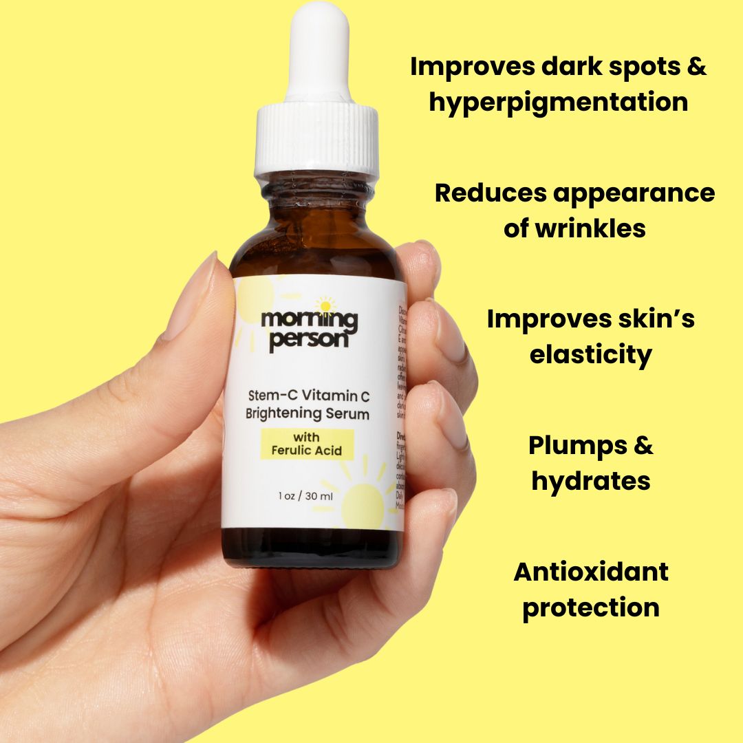 Morning Person Beauty Stem-C Vitamin C Brightening Serum bottle held by hand for 3 step morning skin care routine to brighten, repair and protect skin