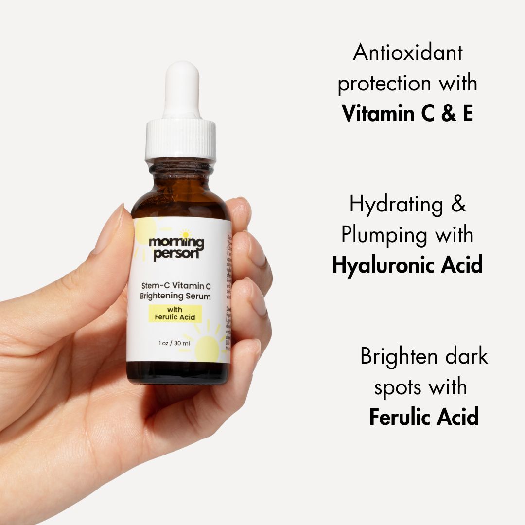Morning Person Beauty vitamin c brightening serum with ferulic acid in brown dropper bottle held in hand
